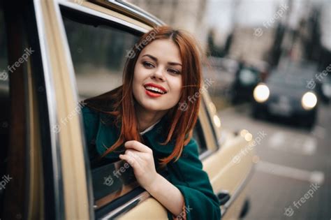 Premium Photo Young Woman In A Car Driver And Passenger Retro Car