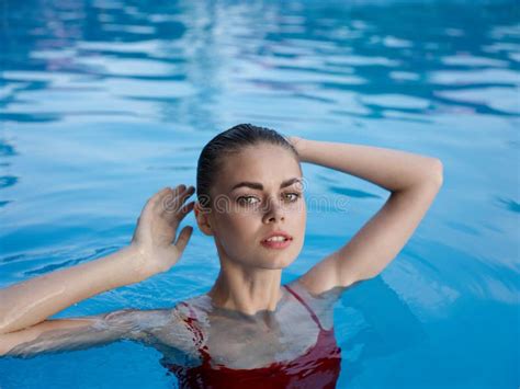 Woman Swimming In The Pool Luxury Nature Vacation Lifestyle Stock Photo