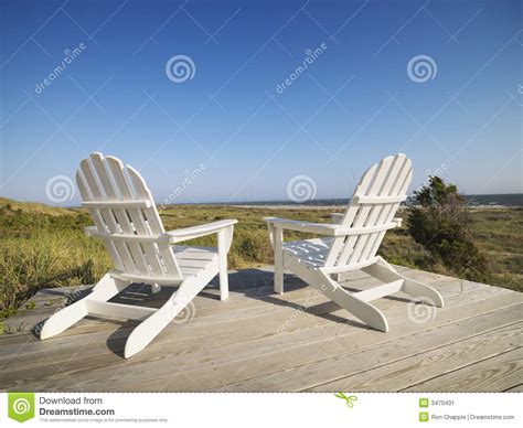 Good luck building your own adirondack beach chair. Deck chairs at beach. stock image. Image of idyllic, north ...