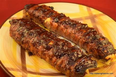 These bacon infused burgers are no joke. Bacon Wrapped Stuffed Burger Dogs Our 500th Recipe