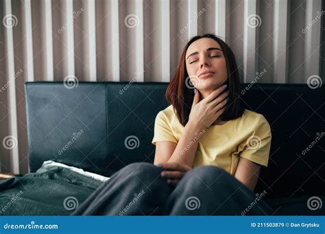 Young Sick Woman With Sore Throat Sitting On Her Bed Stock Image Image Of Patient Unhappy