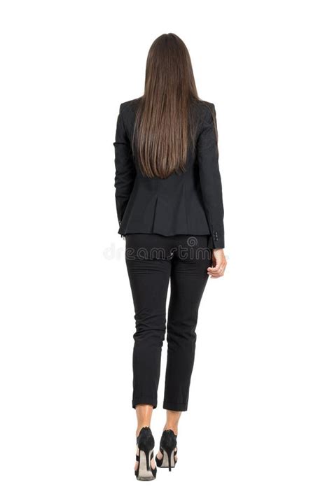 Elegant Woman In Business Black Suit Walking Away Rear View Stock