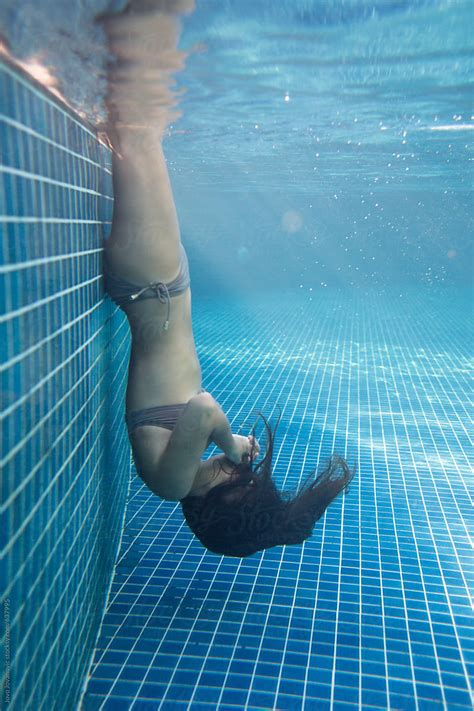 Woman Holding Her Breath Underwater Stocksy United