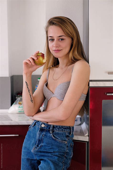 Slim Topless Woman With Apple By Stocksy Contributor Danil Nevsky Stocksy
