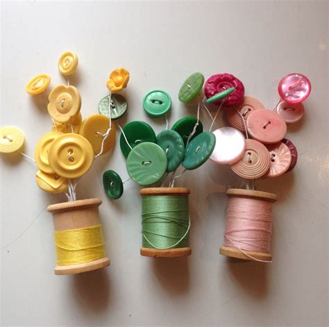 Vintage Buttons And Cotton Reels Repurposed To Make Flowers In A Vase