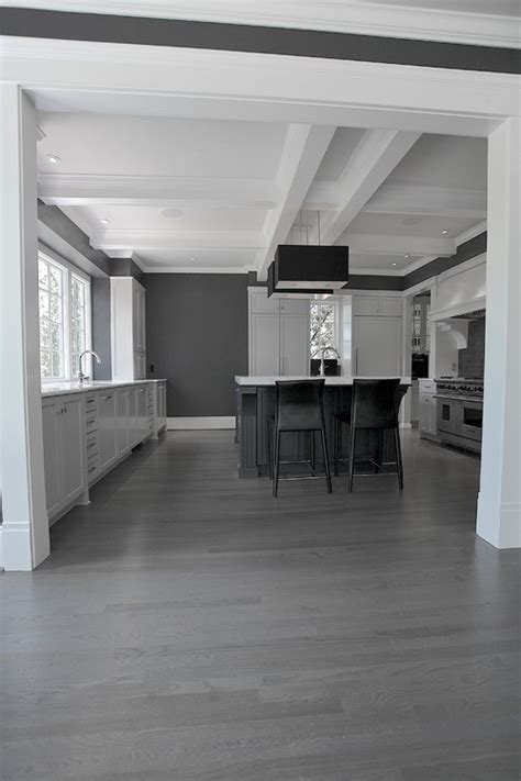 You can find proper grey floors for modern, minimalist, rustic and other décor styles, and the good news is scratches and spots won't strike the eye on grey like it would be with polished black floors, for example. Design in Mind: Gray Hardwood Floors | Coats Homes | Highland Park, TX