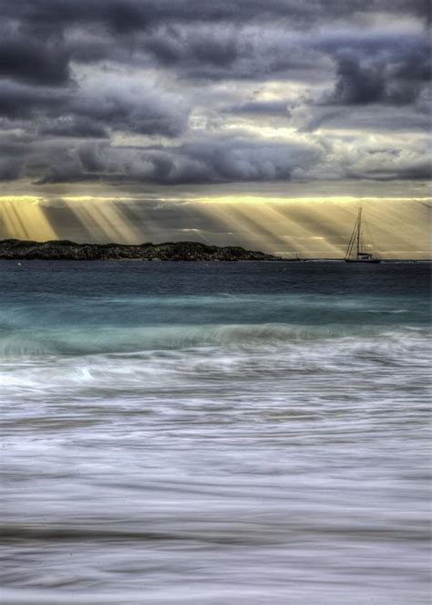 Vertical View Of Small Boat In Sun Rays Photograph By John Supan