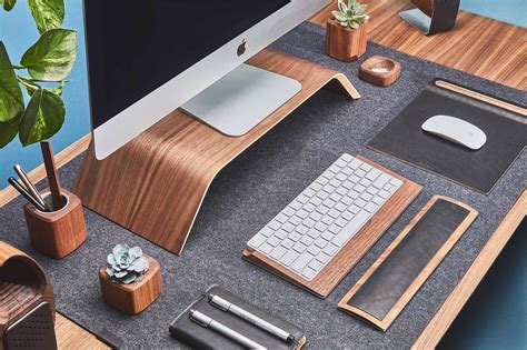 The formula for the perfect ergonomic workstation setup will not be the exact same for everyone. Ergonomic desk setup featuring wooden monitor stand for ...
