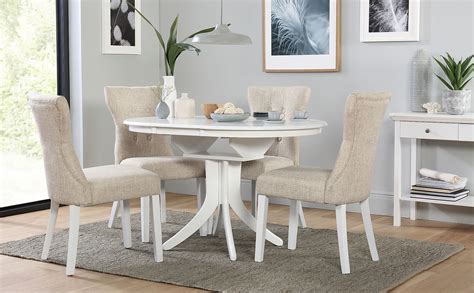 An extendable dining table is a great choice if you're both entertaining large parties and eating at the table with a smaller crowd. Hudson Round White Extending Dining Table with 6 Bewley ...
