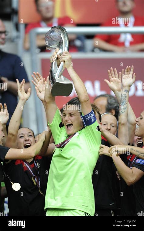Germanys Goalie Nadine Angerer Hoists The Trophy After The Victory By 1 0 In The Uefa Womens