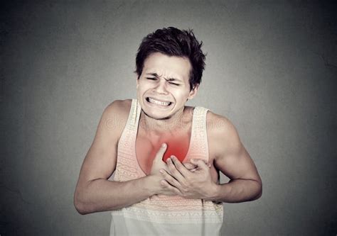 Man Suffering From Severe Sharp Heartache Chest Pain Stock Image