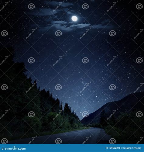 The Starry Sky Moon And The Mountain Road By Night Stock Image