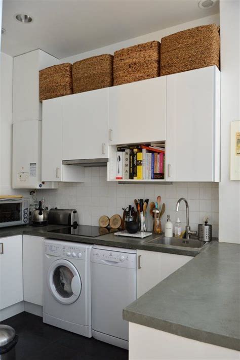 An airy wooden storage unit doubles as a space divider is a cool idea for any modern space an elegant glass fronted storage cabinet with an additional small storage section for smaller stuff on the side an elegant wooden shelf for storing plates and mugs and cups at the same time is perfect for a modern kitchen 9 Ways To Make Existing Storage Cabinets More Space ...