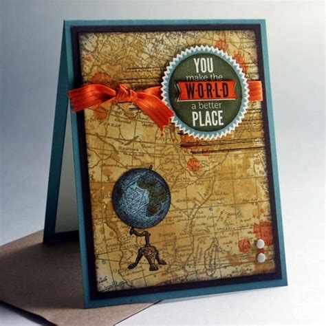 A Card With A World Map On It And A Red Ribbon Around The Edge That