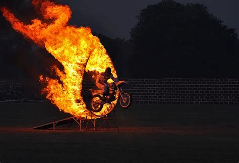A Stunt Man Is Jumping Through Fire Ring In A Show Smithsonian Photo