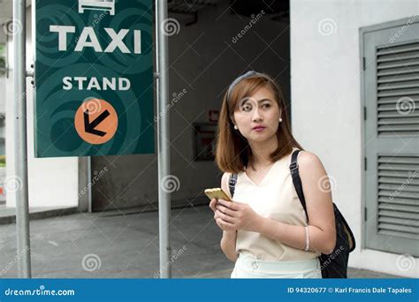 A Woman Is Waiting For A Cab Stock Image Image Of Urban Woman 94320677