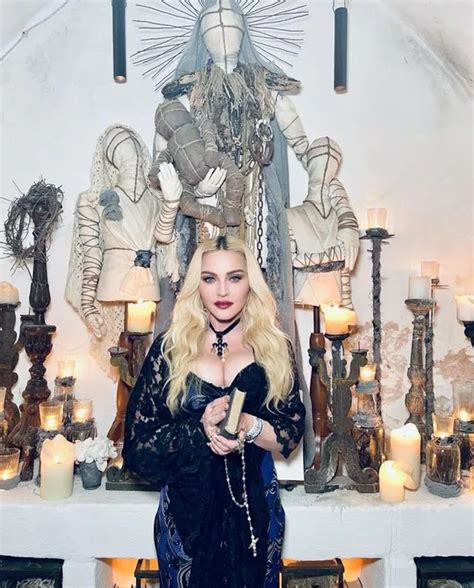 Madonna 63 Is The Ultimate Ageless Beauty As She Flaunts Cleavage In Red Hot Display Daily Star