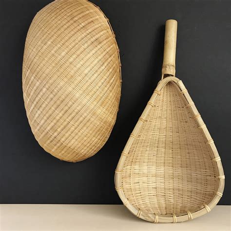 Place one of our rattan baskets next to the couch to store magazines, or use a large vine tote basket to store toys. Woven Wall Baskets|Set of 2|Boho Wall Decor|Hanging Baskets|Woven Bamboo Rattan Oval Basket ...