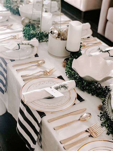 To the right are two large wine glasses, above the utensils. Our 2018 Slava: An Elegant Black, White and Gold Table ...