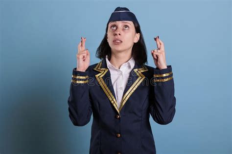Flight Attendant Crossing Fingers Looking Up Praying For Luck Stock Image Image Of Airplane