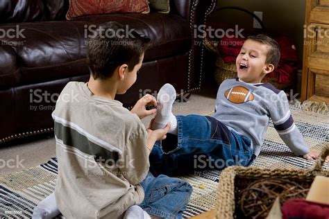 Young Boy Laughing At Tickled Feet Shallow Focus Stock Photo Download