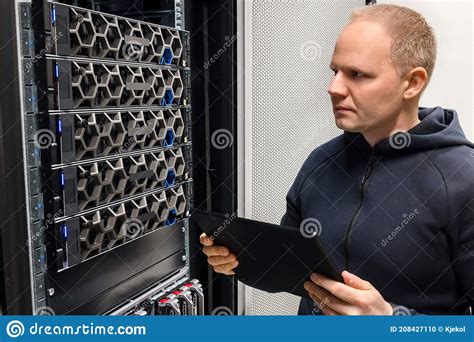 Male Computer Engineer With Digital Tablet Examining Hyperconverged