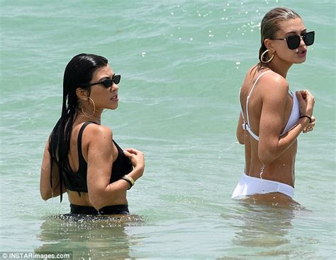 hailey baldwin flaunts tan in sizzling white swimsuit daily mail online