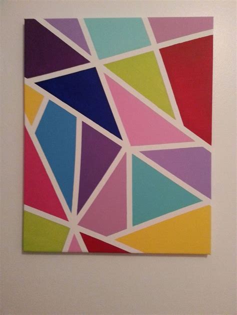 An Abstract Painting With Multicolored Shapes On The Wall In A White