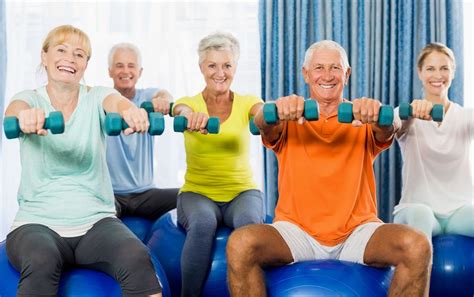 Sit with your forearms resting on your thighs, holding a dumbbell in each hand with your. older adults group fitness