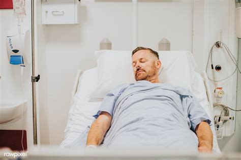 Sick Man In A Hospital Bed Premium Image By Chanikarn