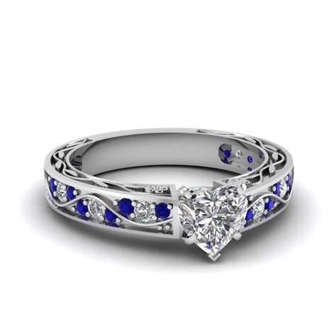 Heart Shaped Diamond Shank Wave Side Stone Engagement Ring With Blue Sapphire In 14k White Gold
