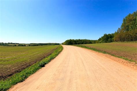 Premium Photo Rural Dirt Road In Belarus Spring Season