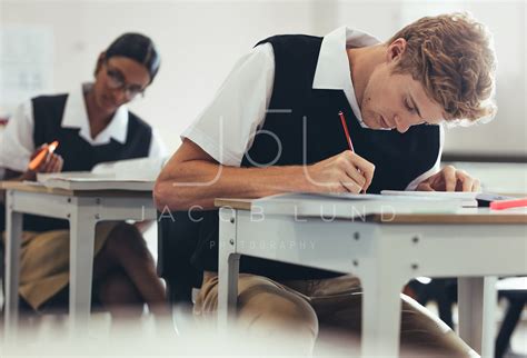 Students Concentrating While Writing During Exam Jacob Lund