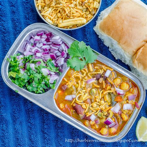 Here dry sabzi is made from sprouted moth that is topped with spicy gravy, fresh onion, tomato and farsan. Herbivore Cucina: Misal Pav