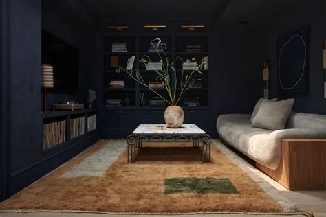 A Living Room Filled With Furniture And A Rug