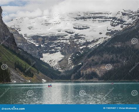 Snow Capped Mountains And Clear Lake Stock Image Image Of Canoe