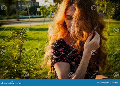Amazing Redhead Lady Wind Swept Hair Covering Her Face With Closed Eyes