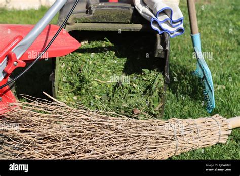 gardening lawn mowing with lawn mower equipment Stock Photo - Alamy