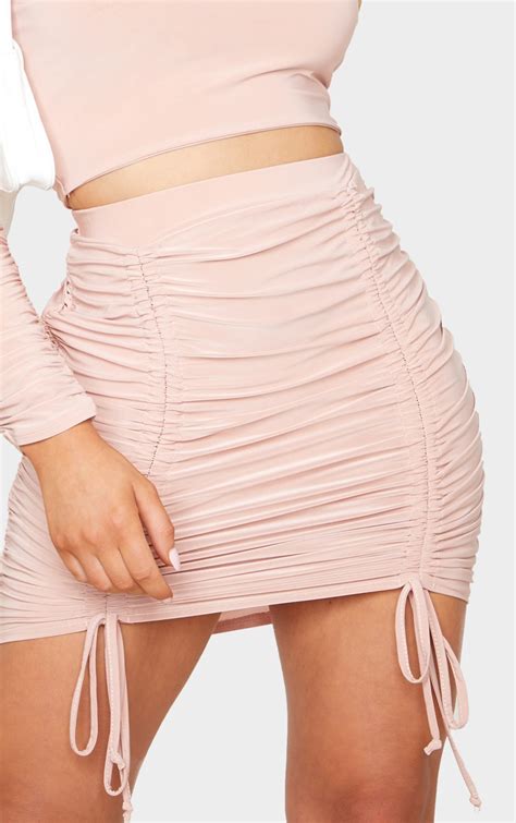 blush slinky ruched front double tie mini skirt prettylittlething