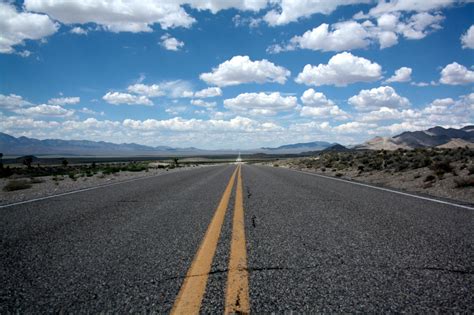 Black Top Road Under Clear Blue Cloudy Sky · Free Stock Photo