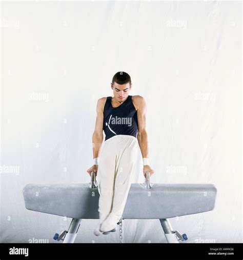 Young Male Gymnast Performing Routine On Pommel Horse Stock Photo Alamy