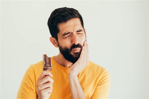 understanding tooth sensitivity causes symptoms and solutions