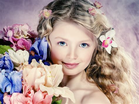 Seriously cute bob hairstyle for curly hair. Cute girl portrait, curly hair, flowers, blue eyes ...