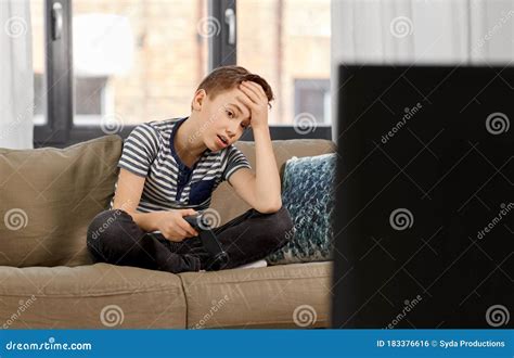 Sad Boy With Gamepad Playing Video Game At Home Stock Photo Image Of