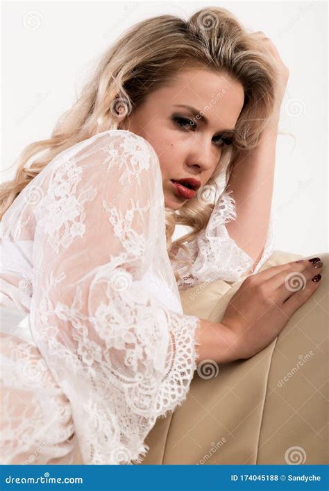 Gentle And Seductive Blonde Woman With Attractive Body In White Lacy