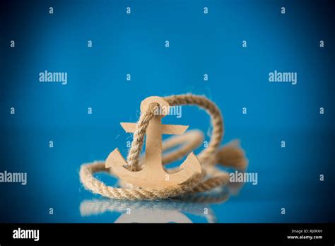 Wooden Decorative Anchor On A Blue Background Stock Photo Alamy