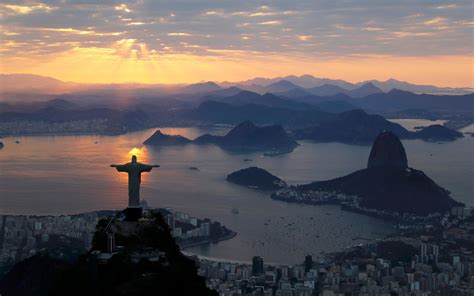 Jesus Christ The Redeemer Is Seen During Sunrise In Rio De Janeiro
