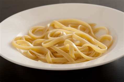 Bowl of plain cooked tagliatelle pasta - Free Stock Image