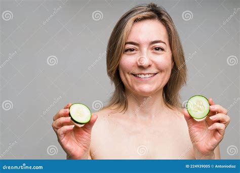 Older Woman About To Put Cucumbers On Her Eyes Stock Image Image Of
