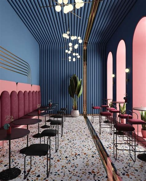 The Interior Of A Restaurant With Pink And Blue Walls Black Chairs